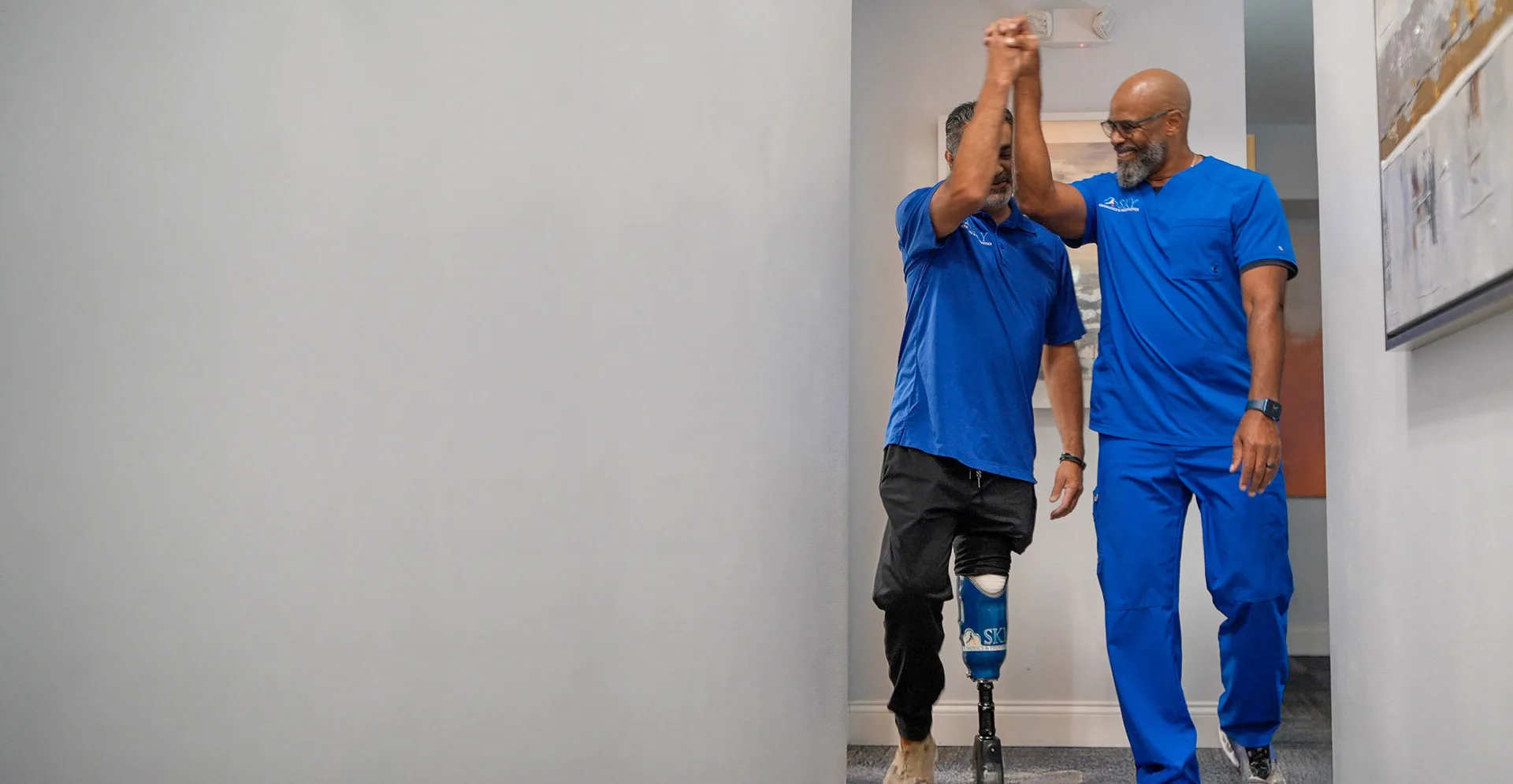 Sky O&P clinician helping patient with rehabilitation